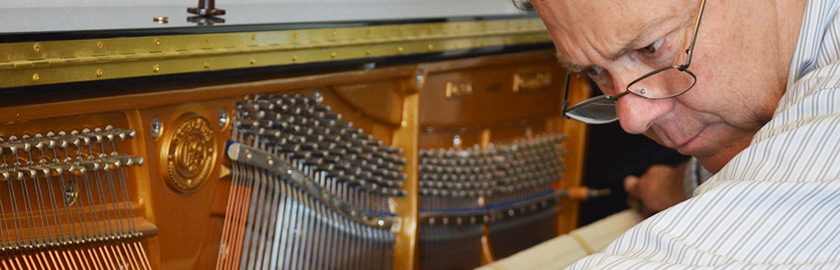 Randy Black servicing upright piano